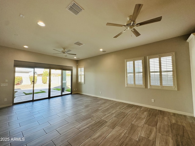 unfurnished room with ceiling fan and light hardwood / wood-style floors