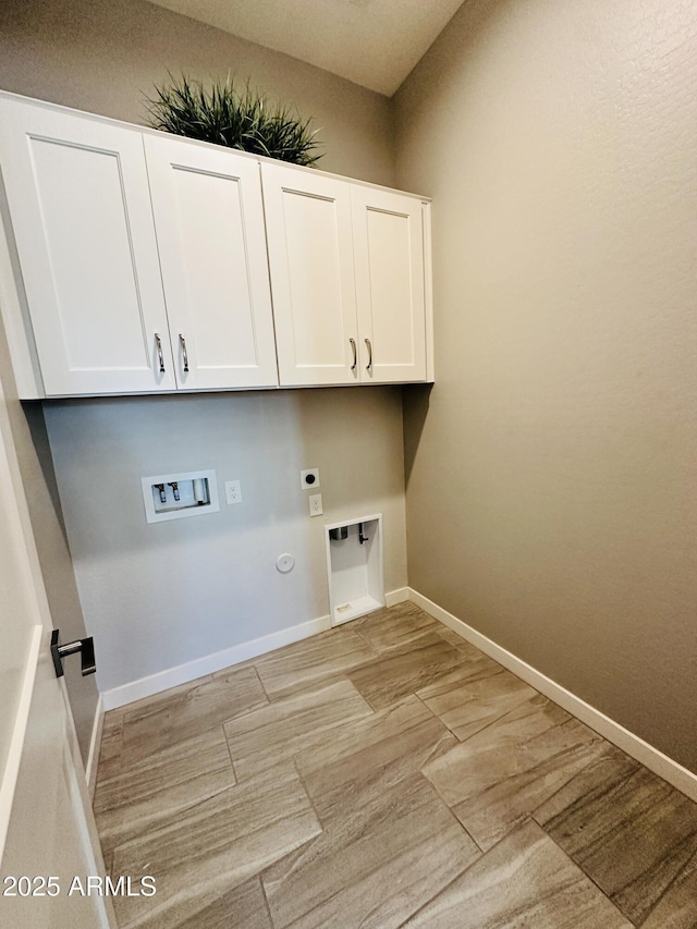 clothes washing area with light hardwood / wood-style flooring, electric dryer hookup, hookup for a washing machine, cabinets, and hookup for a gas dryer