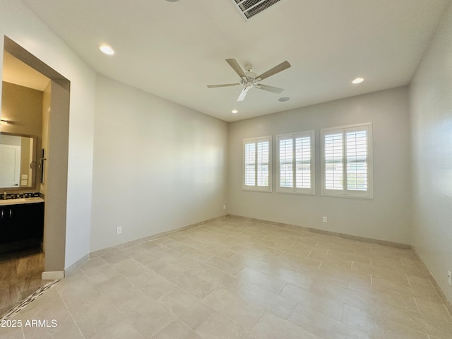 empty room featuring ceiling fan