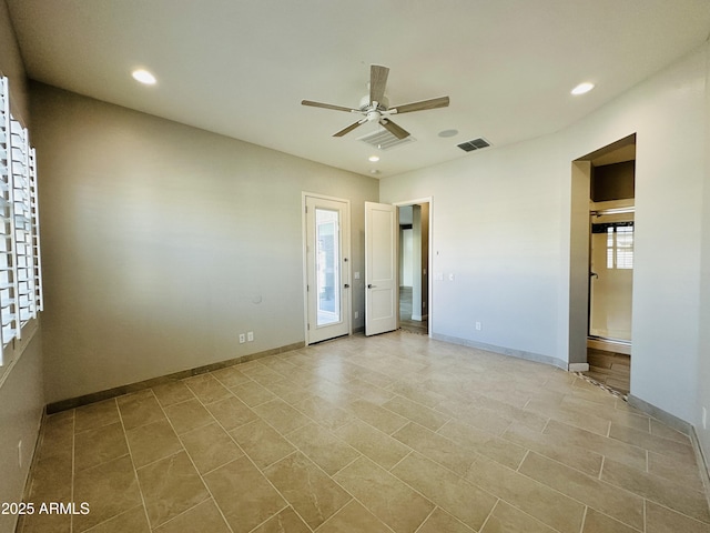 interior space featuring ensuite bathroom and ceiling fan