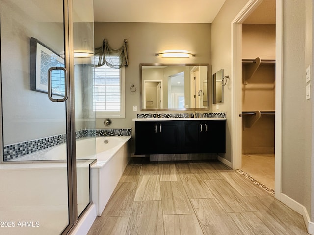 bathroom with vanity and plus walk in shower