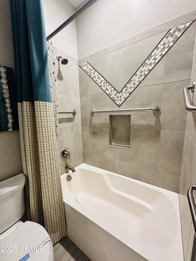 bathroom featuring toilet and shower / bath combo