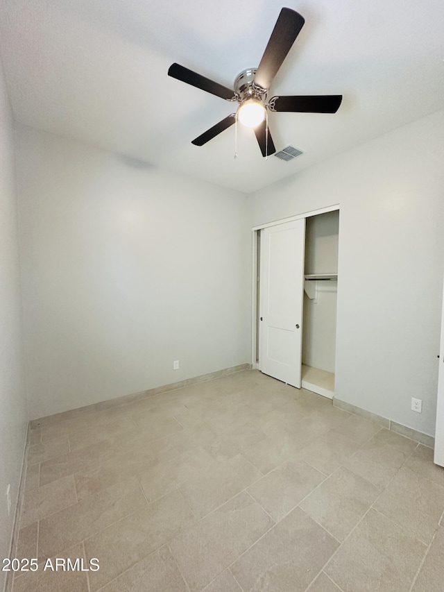 unfurnished bedroom with a closet and ceiling fan