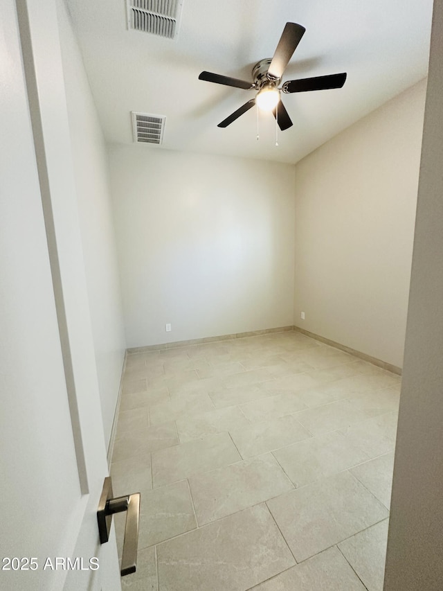 spare room with ceiling fan