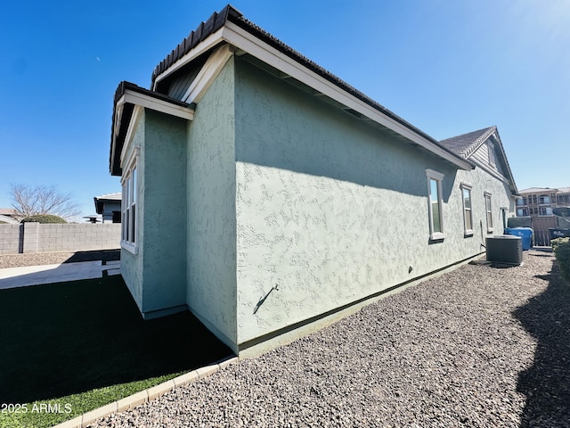 view of side of home with cooling unit