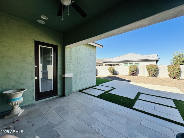 view of patio with ceiling fan