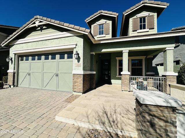 craftsman house with a garage and covered porch