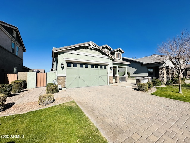 view of front of home featuring a garage and a front lawn