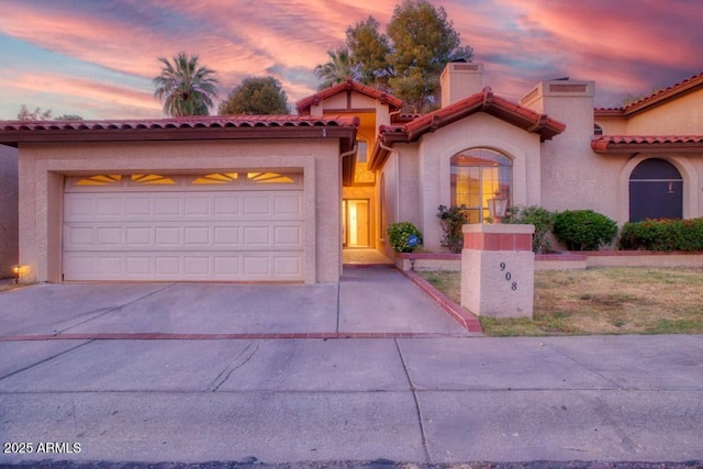 mediterranean / spanish-style house featuring a garage