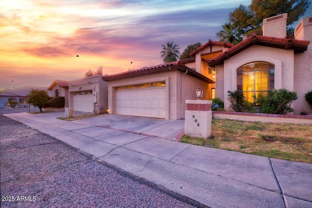 mediterranean / spanish-style home featuring a garage