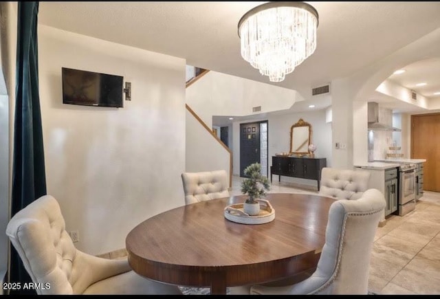 dining space with an inviting chandelier