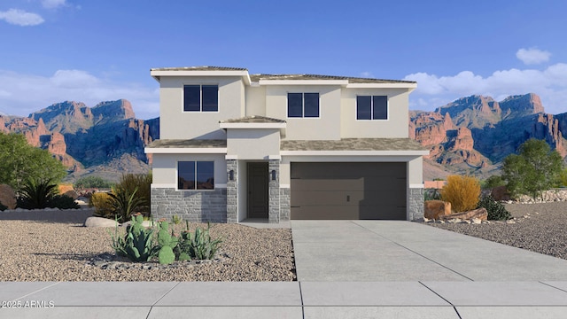 24236 W Southgate Ave, Buckeye, AZ 85326 - view of front facade featuring a mountain view, concrete driveway, stone siding, and an attached garage