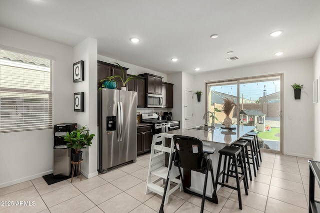 40467 W Jenna Ln, Maricopa, AZ 85138 - dining area with light tile patterned flooring, recessed lighting, visible vents, and baseboards
