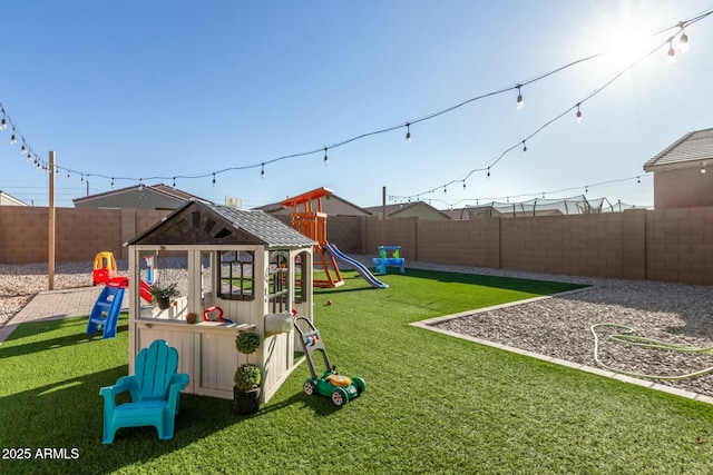 40467 W Jenna Ln, Maricopa, AZ 85138 - view of jungle gym featuring a lawn and a fenced backyard