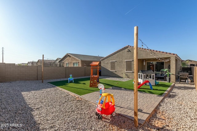 40467 W Jenna Ln, Maricopa, AZ 85138 - exterior space with a patio, a fenced backyard, and a playground