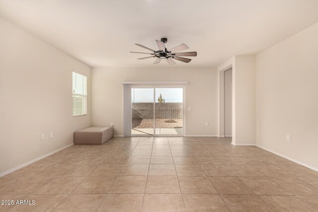 unfurnished room featuring ceiling fan and light tile patterned floors