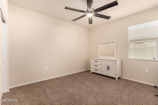 unfurnished bedroom with carpet floors and ceiling fan