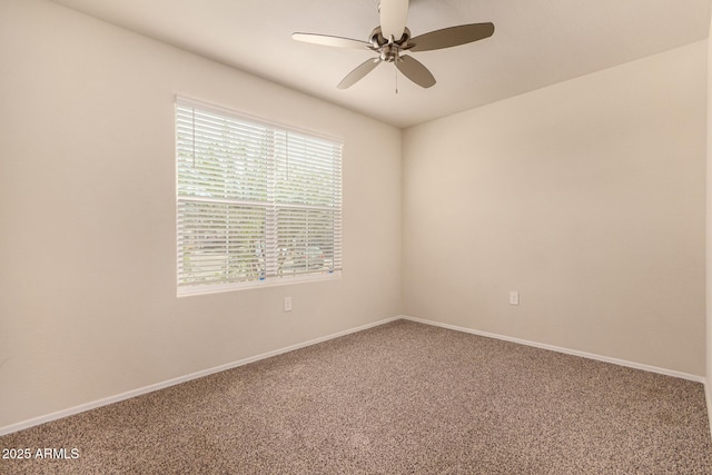 carpeted empty room featuring ceiling fan