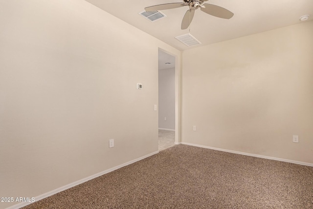 carpeted spare room featuring ceiling fan