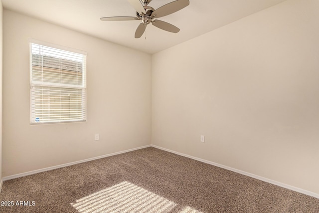 unfurnished room featuring ceiling fan and carpet floors