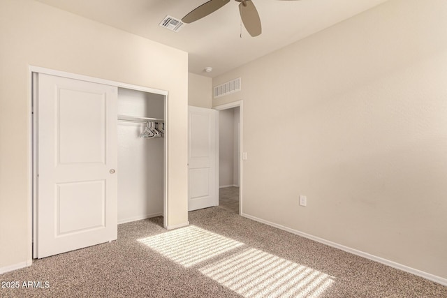 unfurnished bedroom featuring carpet flooring, ceiling fan, and a closet