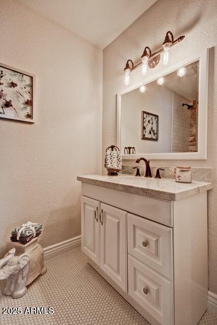 1045 S Solomon St, Mesa, AZ 85204 - bathroom featuring vanity, baseboards, and tile patterned floors