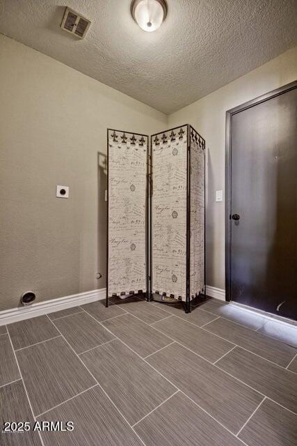 1045 S Solomon St, Mesa, AZ 85204 - laundry room with a textured ceiling, hookup for an electric dryer, and wood finish floors