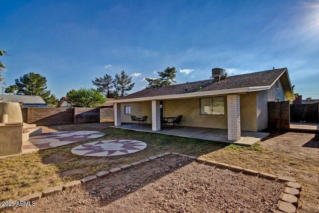 1045 S Solomon St, Mesa, AZ 85204 - rear view of house featuring a fenced backyard, a patio area, and stucco siding