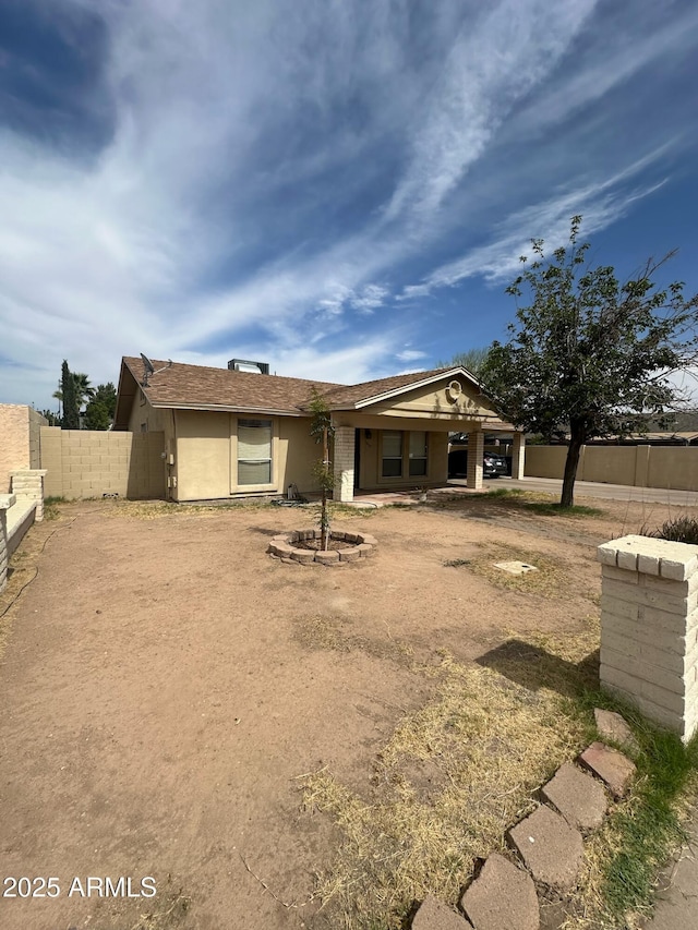 1045 S Solomon St, Mesa, AZ 85204 - rear view of house featuring stucco siding