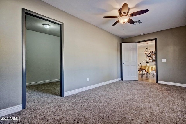 1045 S Solomon St, Mesa, AZ 85204 - unfurnished bedroom featuring carpet flooring, baseboards, and a ceiling fan