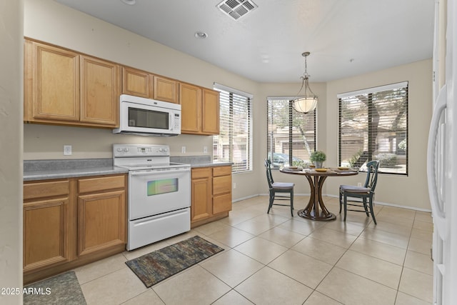 kitchen with white appliances, baseboards, decorative light fixtures, light tile patterned floors, and visible vents