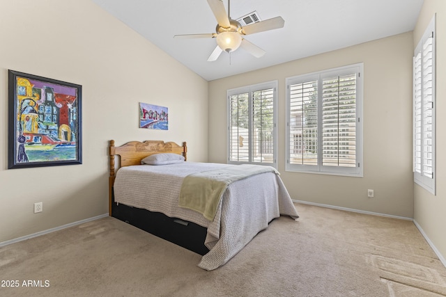 carpeted bedroom with baseboards, ceiling fan, vaulted ceiling, and visible vents