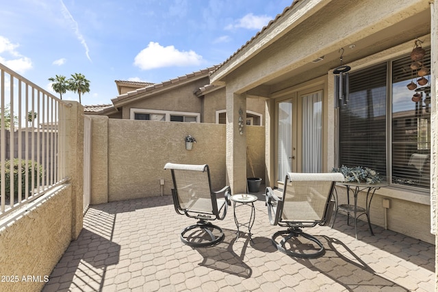 view of patio featuring fence