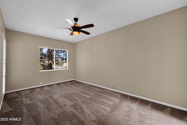 empty room with baseboards, ceiling fan, and carpet flooring