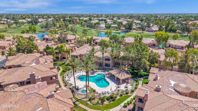 aerial view featuring a residential view, a water view, and golf course view