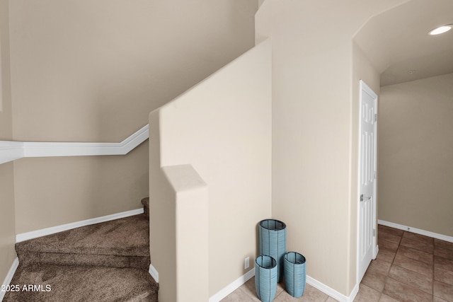 additional living space with baseboards and recessed lighting