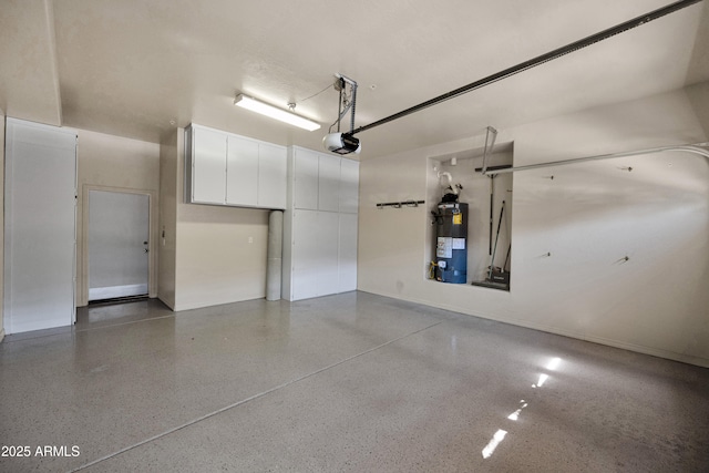 garage featuring baseboards, a garage door opener, and water heater