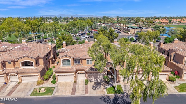 bird's eye view with a water view and a residential view