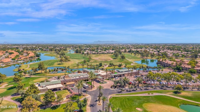 bird's eye view with a water view, view of golf course, and a residential view