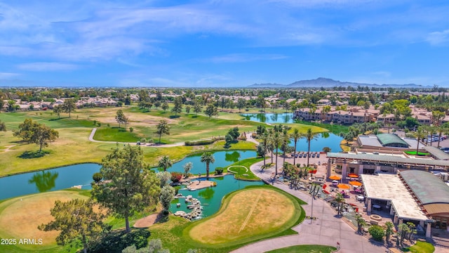 aerial view with a residential view, view of golf course, and a water and mountain view