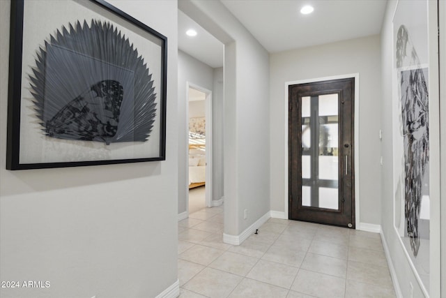 foyer featuring light tile patterned floors