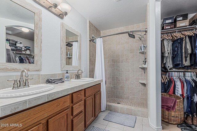 3059 E Tyson Ct, Gilbert, AZ 85295 - full bathroom with a shower stall, double vanity, tile patterned floors, and a spacious closet