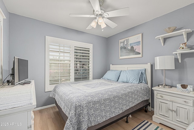 3059 E Tyson Ct, Gilbert, AZ 85295 - bedroom with light wood-style flooring, a ceiling fan, and baseboards