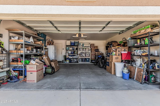 3059 E Tyson Ct, Gilbert, AZ 85295 - garage featuring freestanding refrigerator and a garage door opener