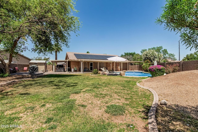 3059 E Tyson Ct, Gilbert, AZ 85295 - back of property with roof mounted solar panels and a patio