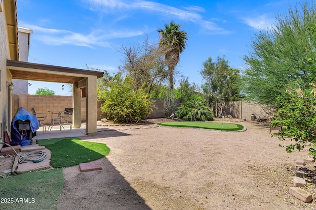 110 E Saddle Way, San Tan Valley, AZ 85143 - fenced backyard with a putting area and a patio area