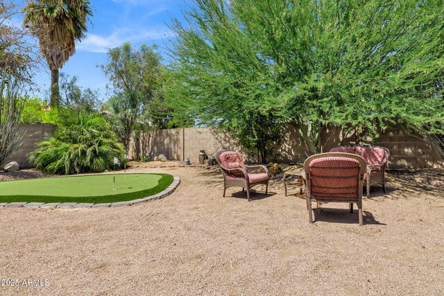 110 E Saddle Way, San Tan Valley, AZ 85143 - fenced backyard featuring a putting area