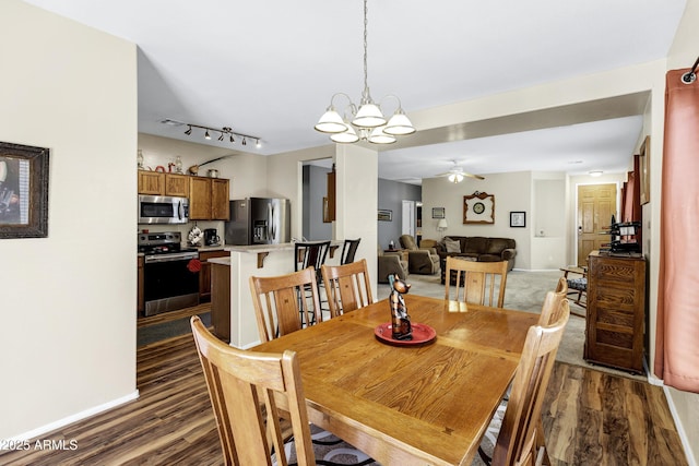 110 E Saddle Way, San Tan Valley, AZ 85143 - dining space featuring dark wood-style flooring, a chandelier, ceiling fan, and rail lighting