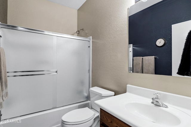 110 E Saddle Way, San Tan Valley, AZ 85143 - bathroom with a textured wall, vanity, and shower / bath combination with glass door