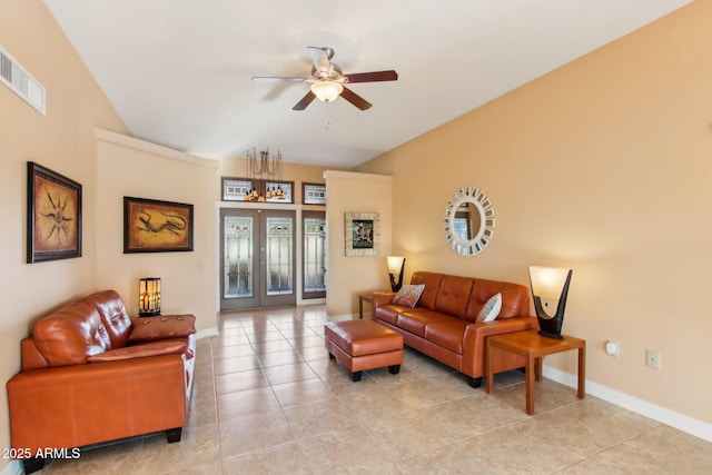 tiled living room featuring french doors and ceiling fan